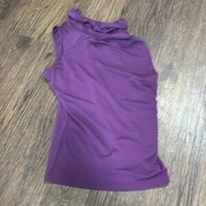 The purple shirt I have never worn. It’s a XS. The crop top is a medium.